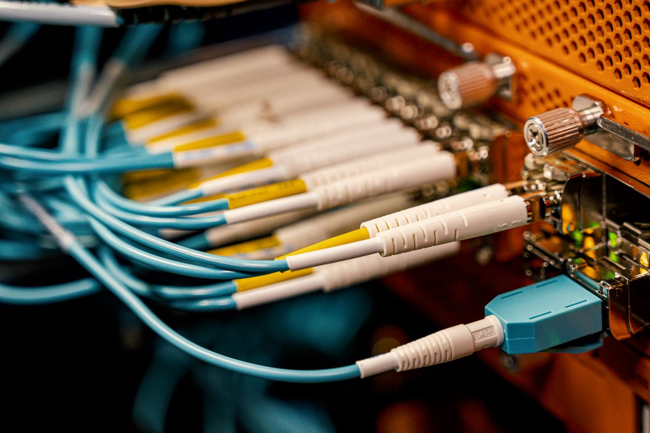 Mastering the First Impression: Your intriguing post title goes here From above of optical switch equipment with many similar connectors with rubber cables and metal parts