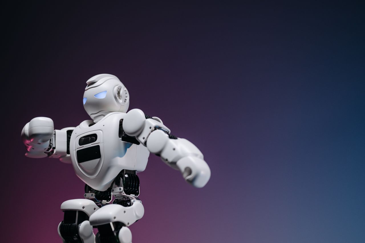 home-hero Close-up of a futuristic robotic toy against a gradient background, symbolizing innovation and technology.